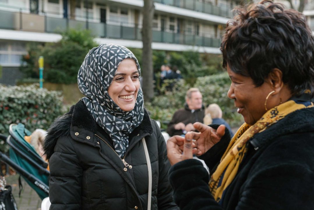 Two women talking together