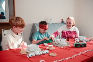 Family around table at Christmas